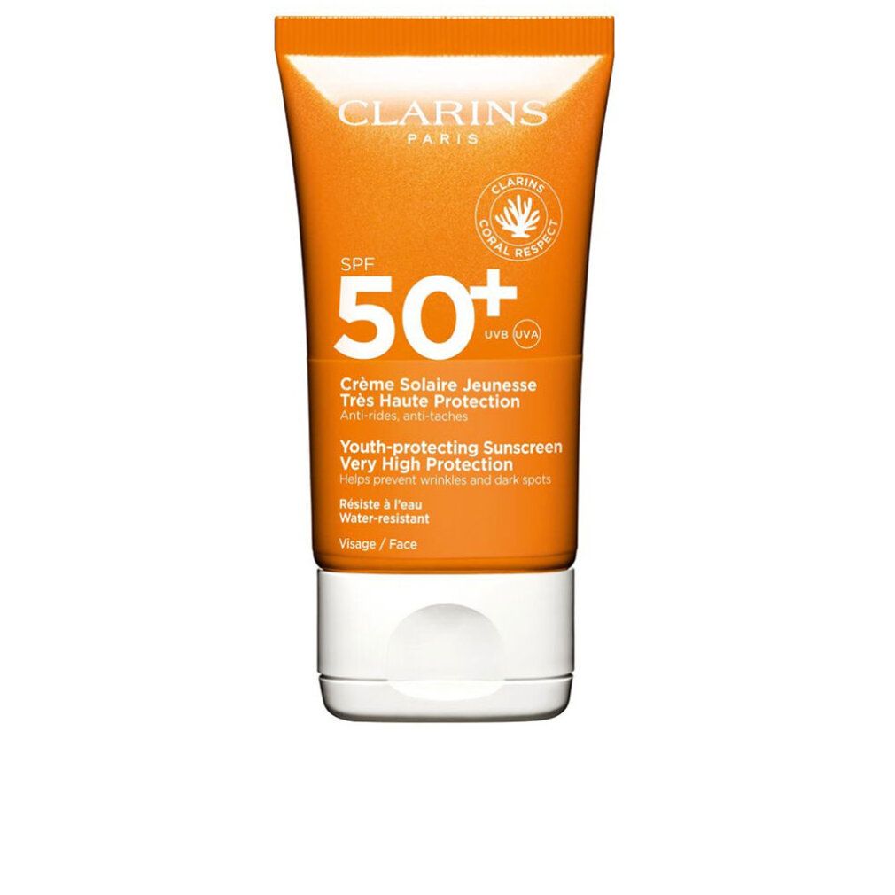 Crème solaire Clarins SPF 50+ visage. Tube orange, bouchon blanc, logo corail.