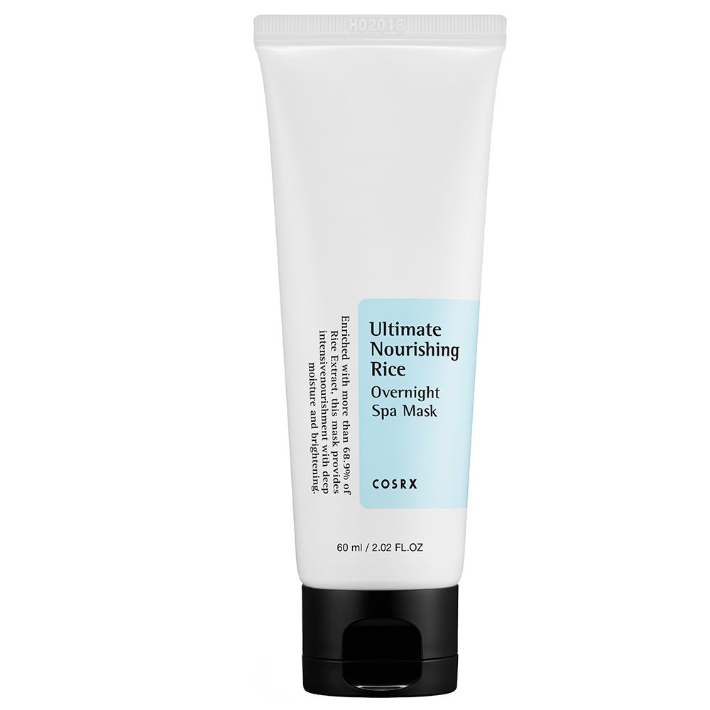 Tube blanc avec bouchon noir, sur fond bleu avec texture crémeuse et texte.