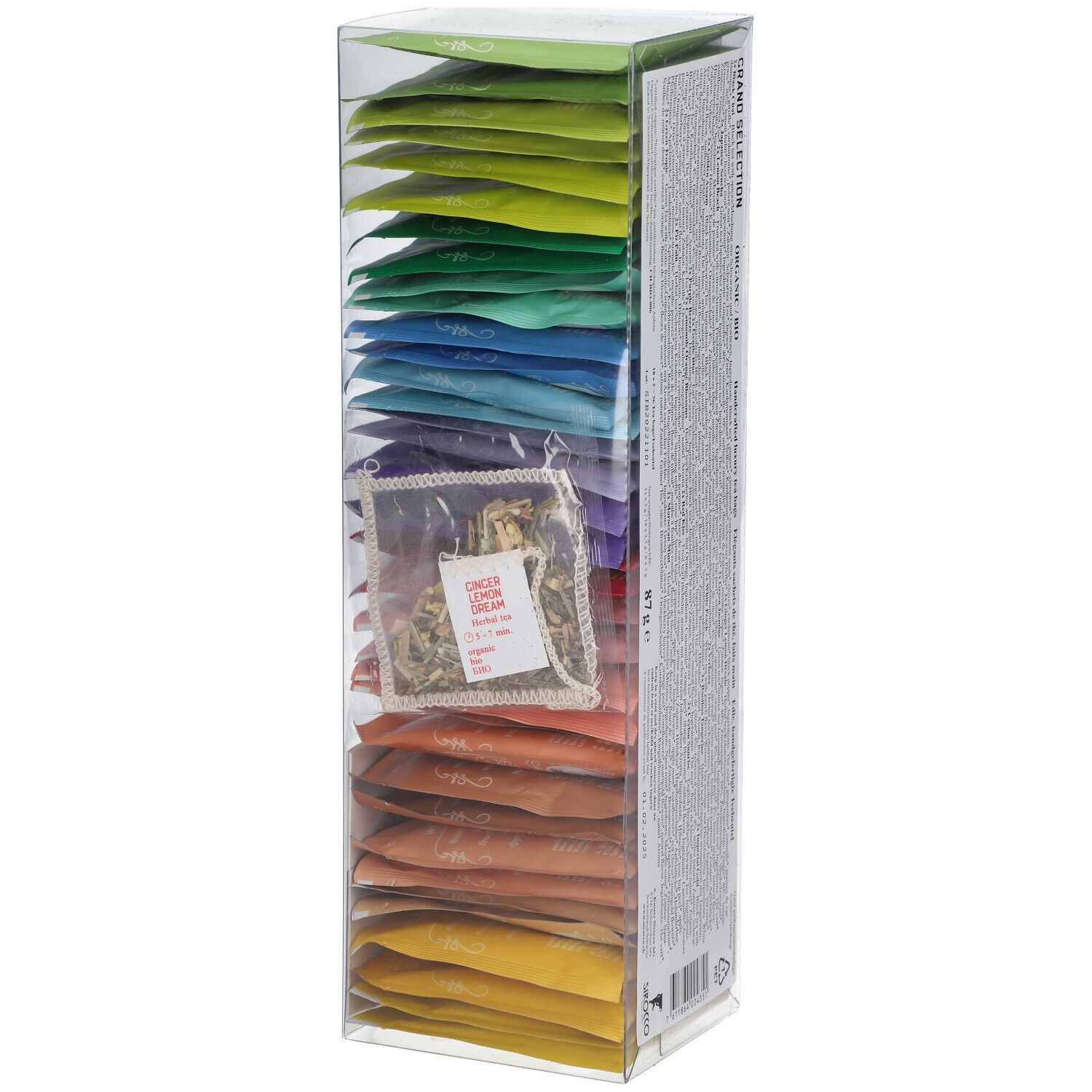 Boîte haute et transparente avec sachets de thé colorés. Sachet de thé individuel visible. Sceau rouge. Logo sur le devant.